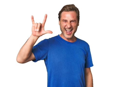 A middle-aged man isolated showing a horns gesture as a revolution concept.