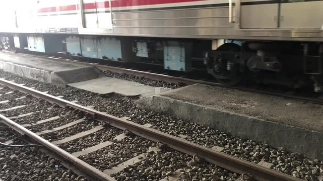 train wheels and tracks, the train is moving slowly