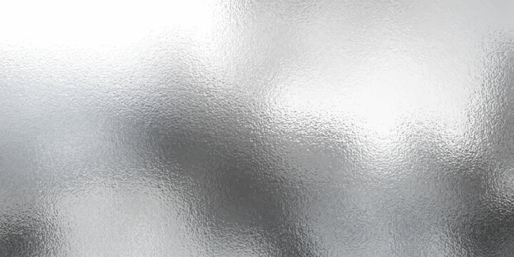 Shiny silver foil metallic texture - glossy gray steel gleaming surface, frosted glass effect with blur glare reflection, bright polished metal material. Brushed aluminum or chrome glistening bg.