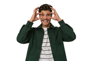 Young handsome caucasian man isolated on white background keeping eyes opened to find a success opportunity.