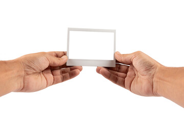 Male hands holding an blank instant photograph isolated no background cutout