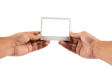 Male hands holding an blank instant photograph isolated no background cutout