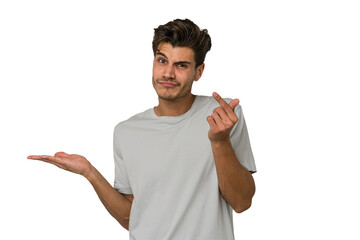 Young handsome caucasian man isolated on white background showing that she has no money.