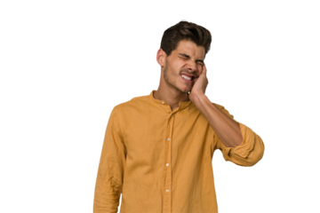 Young handsome caucasian man isolated on white background covering ears with hands.