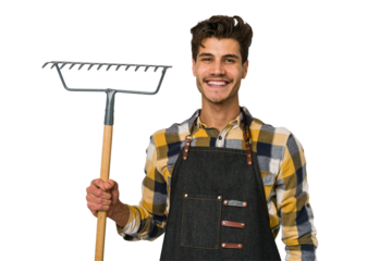 Young caucasian gardener man holding a plant isolated on white background