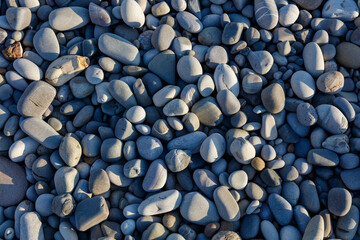 A pile of rocks with a blue tint