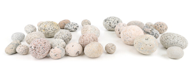 Sea washed oval pebbles isolated on white background. Arrangement of smooth round stones.