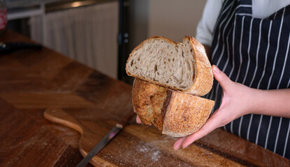 Baker’s Hand Presenting Homemade Sourdough.