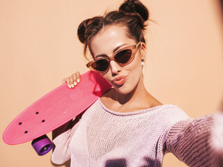 Young beautiful sexy smiling hipster woman in sunglasses.Trendy female in summer knitted...