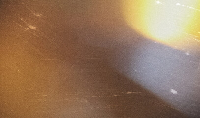 grainy colorful warm orange light leaks on black background with dust texture. abstract damaged...