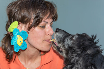 Woman Eating French frites with her Dog in Switzerland.