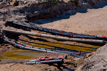 Road construction work. Covering electrical cables with a protective sheath.