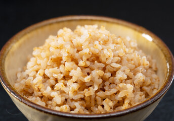 Freshly Cooked Brown Rice on a Black Background