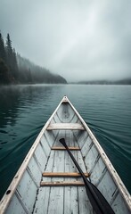 Naklejka premium Serene Foggy Lake Rowboat Adventure Wooden Boat Paddle Calm Water Misty Forest Scenery