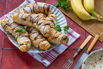Bananas and chocolate spread baked in puff pastry