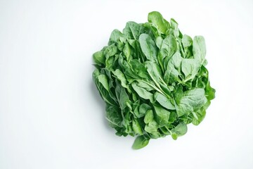 Fresh spinach bunch close up on white background overhead studio shot for healthy eating and vegan lifestyle