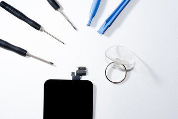 The smartphone was damages and need to repair  which tools smartphone that stand on white background by hands of repairman.