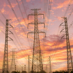silhouette high voltage pole on sky sunset background.	