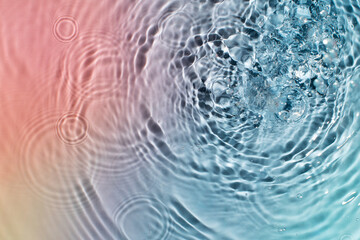 Abstract colorful background of water under sunlight. Top view, flat lay.