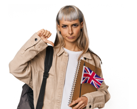 Young erasmus student with books showing a dislike gesture, thumbs down. Disagreement concept.