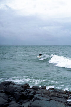 Man surfs the ocean waves in Australia