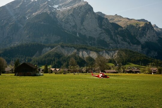 Red helicopter on the green grass