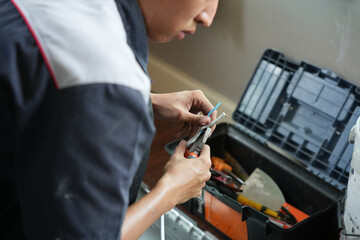 Air conditioning technician connecting electric wires to install new air conditioners, Repairman fix air conditioning systems, Technician man service for repair and maintenance of air conditioning