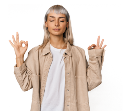 Young caucasian young woman in studio relaxes after hard working day, she is performing yoga.