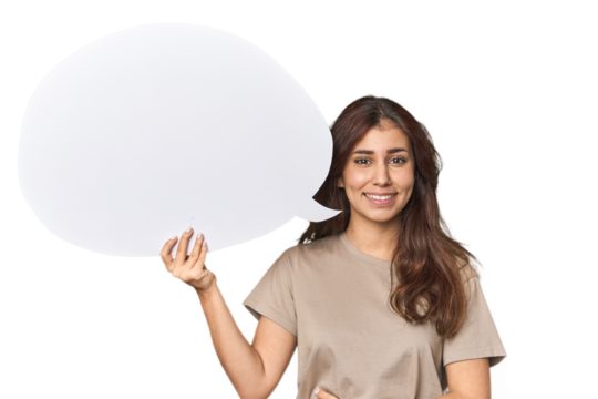 Middle Eastern woman holding comic bubble laughing and having fun.