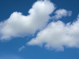White fluffy clouds in the blue sky