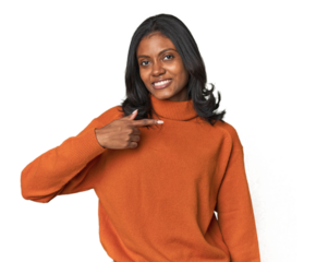 Portrait of a young Indian woman person pointing by hand to a shirt copy space, proud and confident