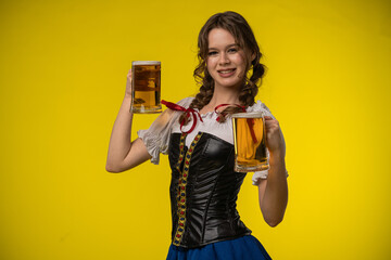 Young Woman in Traditional Costume with Beer Mugs