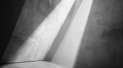 Gray concrete walls illuminated by shaft of light.