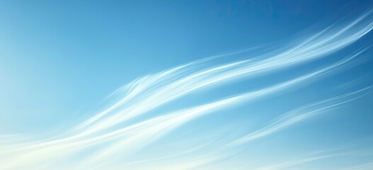 Wispy clouds flowing across a vibrant blue sky