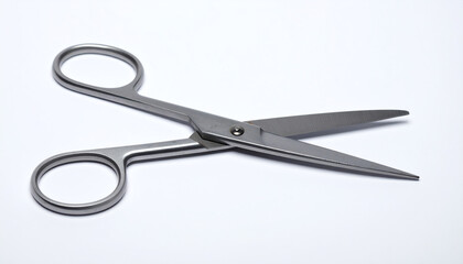 Obraz premium A pair of stainless steel scissors positioned on a white background, showcasing its sharp blades and ergonomic design