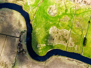 Top Down over Farms and River Dochart and Road A85 from a drone, Perthshire, Scotland, UK