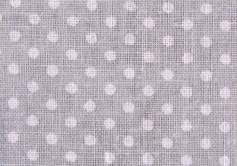 grey cotton fabric with small white polka dots