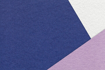 Fototapeta premium Texture craft navy blue paper background with white and violet border. Vintage abstract denim cardboard.