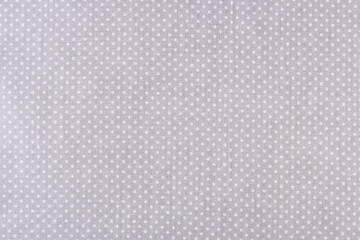 grey cotton fabric with small white polka dots