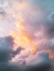 Fototapeta premium Dramatic clouds at dusk with colorful light in the sky; low angle view of a beautiful sunset with pastel colors