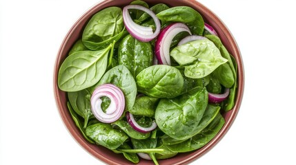 Obraz premium A spinach salad with red onions in a wooden bowl.