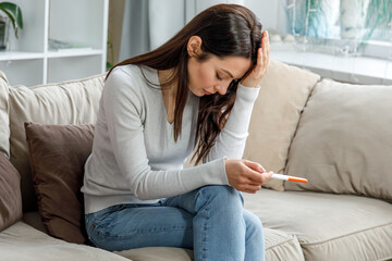 Disappointed woman after negative pregnancy result