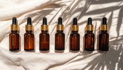 Showcasing natural beauty with essential oil bottles on soft fabric indoor setting aesthetic photography warm tones