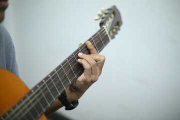 man playing guitar acoustic