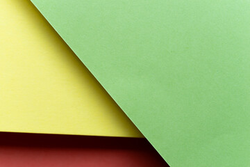 重なる赤色と黄色と緑色の背景	