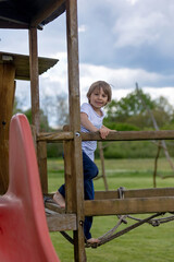Obraz premium Child, playing on playground springtime, enjoying nice weather