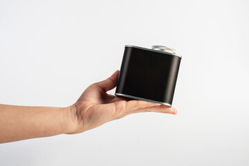 Black can for packaging in hand on white background.