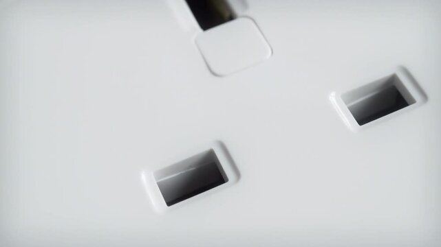UK white electrical wall socket close up stock footage