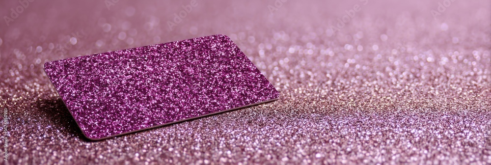 Poster glossy gift card resting on shimmering surface reflecting soft light in vibrant colors