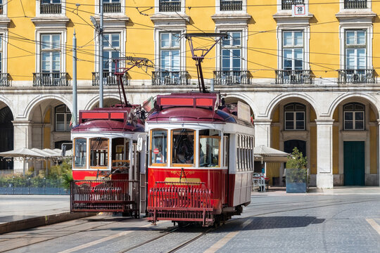 Two Classic Red Trams in Praca do Comercio, Lisbon, Portugal